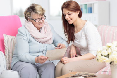 nurse and senior talking